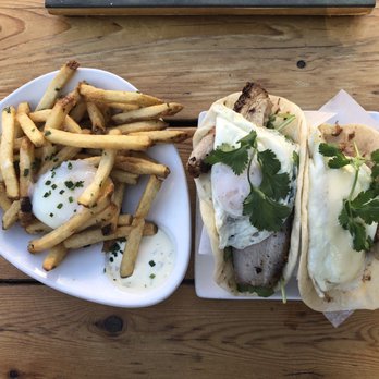 Salty Sow - Left: duck fat fries. Right: pork belly taco and carnitas taco - American Near Me - Austin, Texas Salty Sow - Left: duck fat fries. Right: pork belly taco and carnitas taco - American Near Me - Austin, Texas