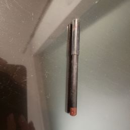 Lipliner found on the floor near the side dresser. Dust was found on it. Lipliner found on the floor near the side dresser. Dust was found on it.