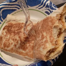 My chicken quesadilla (with several bites in) looks more like a burrito than a quesadilla. (Yes, I stabbed it with a fork lol)