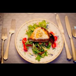 Cuisine de Sylvie - Warm Goat Cheese on French Artisan Toast on a bed of Mixed Greens with our  House Dijon Balsamic Vinaigrette