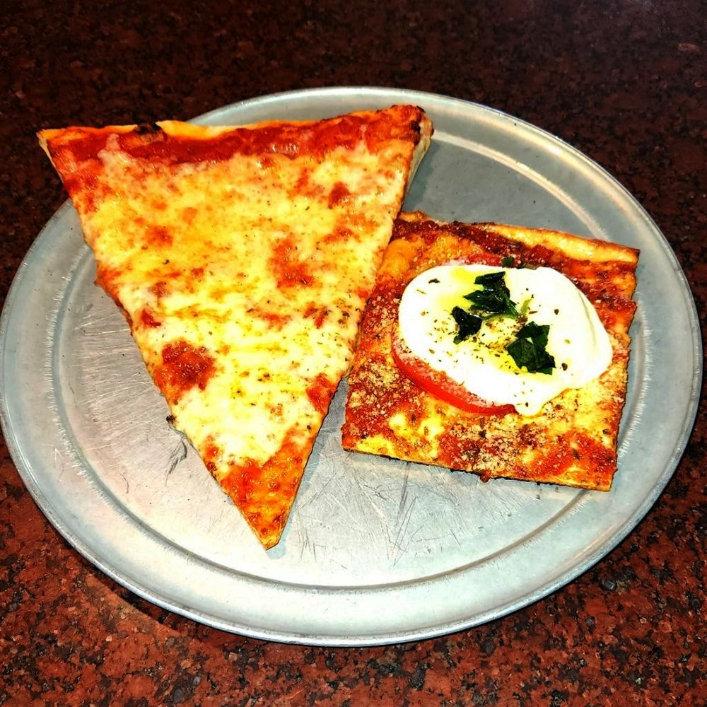 Dominic's I Pizza and Pasta - two slices of pizza on a plate - Pizza Near Me - Boca Raton, Florida Dominic's I Pizza and Pasta - two slices of pizza on a plate - Pizza Near Me - Boca Raton, Florida