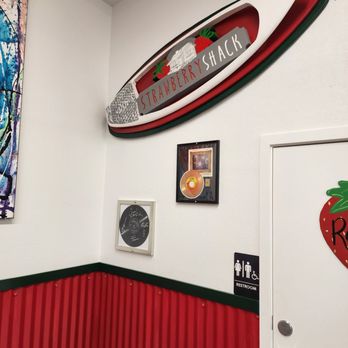 The Strawberry Shack - a surfboard mounted on the wall - Desserts Near Me - Oceanside, California