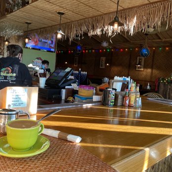 The Bungalow - a table with a cup of coffee on it - American Near Me - Long Beach, New York