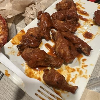 Pizza Twist - Achari chicken wings, fork is placed to compare size of wings - Pizza Near Me - Boise, Idaho Pizza Twist - Achari chicken wings, fork is placed to compare size of wings - Pizza Near Me - Boise, Idaho