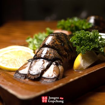 Jongro Gopchang - grilled fish on a cutting board - Korean Near Me - New York, New York Jongro Gopchang - grilled fish on a cutting board - Korean Near Me - New York, New York