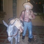 Photo of Wheel Inn Restaurant - Cabazon, CA, United States. Prospector and trusty companion outside.