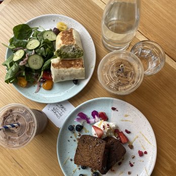 Bluestone Lane Rice Village Café - Banana bread, athlete burrito, mocha latte, vanilla latte with almond milk and one pump of vanilla. - Coffee & Tea Near Me - Houston, Texas
