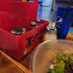 Saucy's Pizzeria-High Ridge - Each table has a condiment basket