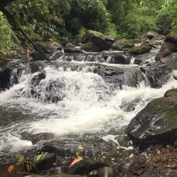 Shallow pools make soaking beneath these mini-falls a must
