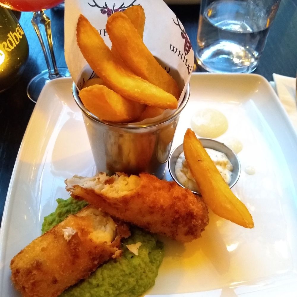 WHISKI Rooms - VERY tasty fish and chips with mushy peas. The chips are crisp, fish very flavorful with a zesty tartar sauce. Yummy mushy peas, too. - British Near Me - Edinburgh, EDH WHISKI Rooms - VERY tasty fish and chips with mushy peas. The chips are crisp, fish very flavorful with a zesty tartar sauce. Yummy mushy peas, too. - British Near Me - Edinburgh, EDH