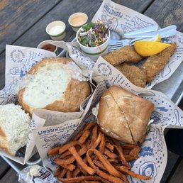 Clam chowder in bread bowl, Fish and Chips Combo (with kale slaw), crab sandwich with sweet potato fries Clam chowder in bread bowl, Fish and Chips Combo (with kale slaw), crab sandwich with sweet potato fries
