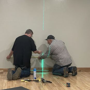 AAA Taylor Glass & Mirror - Measuring to make sure the mirror is centered on the wall. - Windows Installation Near Me - Mount Pleasant, Texas AAA Taylor Glass & Mirror - Measuring to make sure the mirror is centered on the wall. - Windows Installation Near Me - Mount Pleasant, Texas