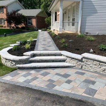 Green Operations - a brick walkway with steps leading up to a house - Landscaping Near Me Green Operations - a brick walkway with steps leading up to a house - Landscaping Near Me