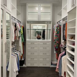 Avanti Closets & Cabinetry - Custom walk in with upper cabinets, mirror, glass shelves and glass doors