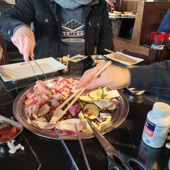 Ombu Grill - Cooking the vegetables and beef brisket - Korean Near Me - Midvale, Utah Ombu Grill - Cooking the vegetables and beef brisket - Korean Near Me - Midvale, Utah