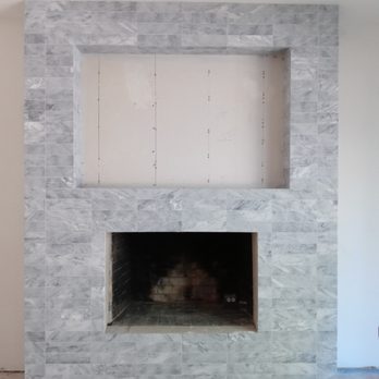 Magnum Tile - Fireplace 
We use gray marble. - Tiling Near Me