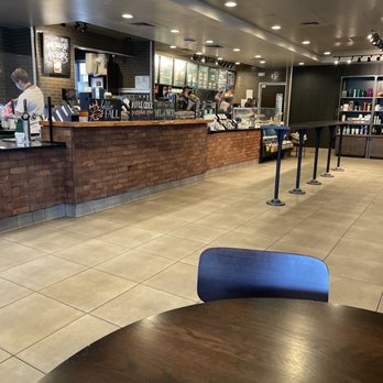 Starbucks - Front counter with busy employees and goodies - Coffee & Tea Near Me - Highlands Ranch, Colorado