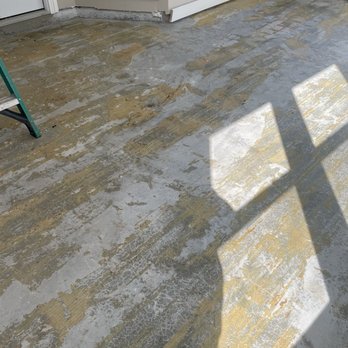 Kabolyn Company - Left the floor with all this glue on the concrete after removing the wood buckled floor. - Handyman Near Me