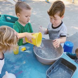 Zion Christian Preschool - Playing in water on a hot day