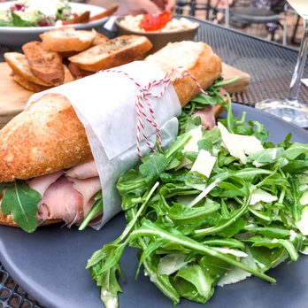 Tilman's - Classic French baguette with French ham, Brie, Dijon and lemon shallot dressed greens - Wine Bars Near Me - Charlottesville, Virginia Tilman's - Classic French baguette with French ham, Brie, Dijon and lemon shallot dressed greens - Wine Bars Near Me - Charlottesville, Virginia