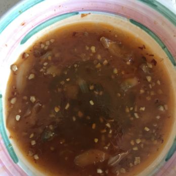 Simple Thai - This is the oil and garlic residue left in my plate. This was NOT a soup, and also not a "sauce". This is pure cooking oil. - Thai Near Me - Vallejo, California