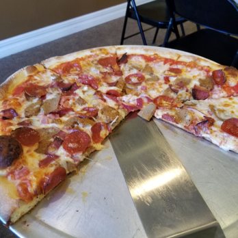 Slices Pizza - Couldn't wait to eat. Was a few slices in before I remembered to snap a pic!! - Pizza Near Me - Melbourne, Florida Slices Pizza - Couldn't wait to eat. Was a few slices in before I remembered to snap a pic!! - Pizza Near Me - Melbourne, Florida