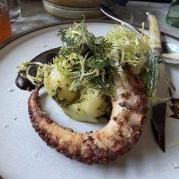 Octopus with Russian potato salad and black garlic sauce Octopus with Russian potato salad and black garlic sauce