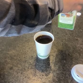 DOMA Coffee Roasting Company - a person reaching for a cup of coffee - Coffee & Tea Near Me - Post Falls, Idaho DOMA Coffee Roasting Company - a person reaching for a cup of coffee - Coffee & Tea Near Me - Post Falls, Idaho
