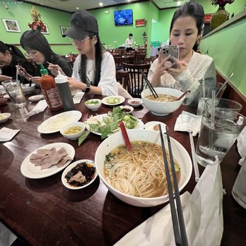Pho Sate - a group of people eating at a restaurant - Vietnamese Near Me - Falls Church, Virginia