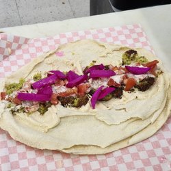 Almadina Supermarket - Falafel wrap in process
