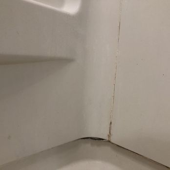 Bath Fitter - Cracked caulking on surround - Kitchen & Bath Near Me - Kent, Ohio Bath Fitter - Cracked caulking on surround - Kitchen & Bath Near Me - Kent, Ohio