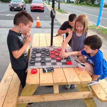 Broadway Scoops - children playing checkers on a picnic table - Ice Cream & Frozen Yogurt Near Me - Pennsville, New Jersey Broadway Scoops - children playing checkers on a picnic table - Ice Cream & Frozen Yogurt Near Me - Pennsville, New Jersey