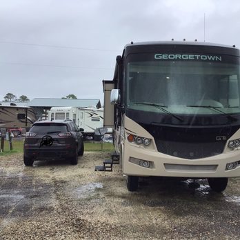 Bay Palms RV Resort - Just to left of car is next site.  I may even have to move it if someone comes in! - RV Parks Near Me - Coden, Alabama