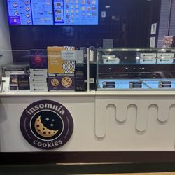 Insomnia Cookies - Front lobby with display case and menu