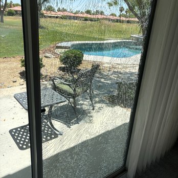 Pro Glass & Mirror - Before picture of slider that is shattered with golf ball. - Windows Installation Near Me - Palm Desert, California Pro Glass & Mirror - Before picture of slider that is shattered with golf ball. - Windows Installation Near Me - Palm Desert, California