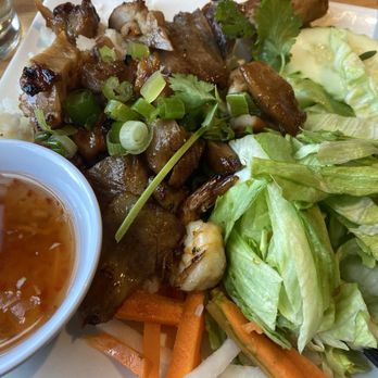 La Sen Vietnamese Grill - Sai Gon combo over rice. Pork, chicken, "shrimp", spring roll and lettuce, pickled daikon and carrots. - Vietnamese Near Me - Tualatin, Oregon La Sen Vietnamese Grill - Sai Gon combo over rice. Pork, chicken, "shrimp", spring roll and lettuce, pickled daikon and carrots. - Vietnamese Near Me - Tualatin, Oregon