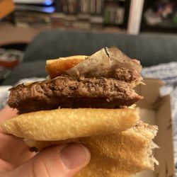 McDonald's - Paper packaging cooked onto burger patty