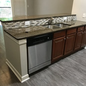 The Bricks Perimeter Center Apartments - Kitchen floors develop gaps with use because they were not adhered - Apartments Near Me - Atlanta, Georgia The Bricks Perimeter Center Apartments - Kitchen floors develop gaps with use because they were not adhered - Apartments Near Me - Atlanta, Georgia