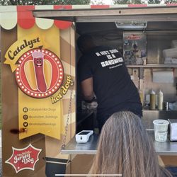 Catalyst Hot Dogs - The vendor is working a grill in that trailer!
