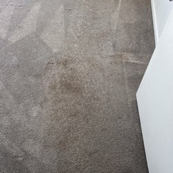 Inside Out Cleaning Services - The room with the worst stain, after the company "cleaned" the carpet.