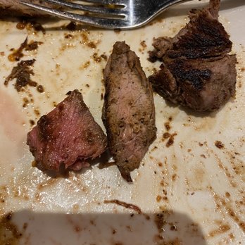 Outback Steakhouse - Both medium cooked. Two different steaks but same type of steak. Both requested medium cooked. One was so dry it wasn't eaten. - Steakhouses Near Me - Edgewater, New Jersey