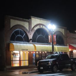 Exterior outside entrance of Isaac & Moishe's - Evening storefront view. - Highwood, Illinois Exterior outside entrance of Isaac & Moishe's - Evening storefront view. - Highwood, Illinois