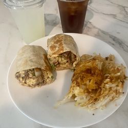 Sunny & Fine's Breakfast Burritos - Steak Breakfast Burrito with added bacon and peppers. Side of hash browns. Lemonade and Iced Tea