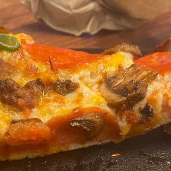 Round Table Pizza - Slice of well done, Italian Garlic Supreme with zesty red sauce. - Pizza Near Me - Simi Valley, California Round Table Pizza - Slice of well done, Italian Garlic Supreme with zesty red sauce. - Pizza Near Me - Simi Valley, California