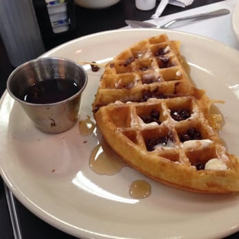 C's Waffles - Half chocolate chip waffle covered in syrup. - Breakfast & Brunch Near Me - New Smyrna Beach, Florida