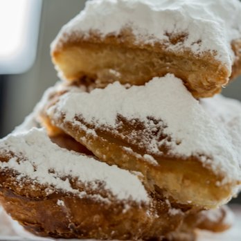 Meaux Beignet - a stack of powdered sugared doughnuts - Food Trucks Near Me - Bentonville, Arkansas Meaux Beignet - a stack of powdered sugared doughnuts - Food Trucks Near Me - Bentonville, Arkansas