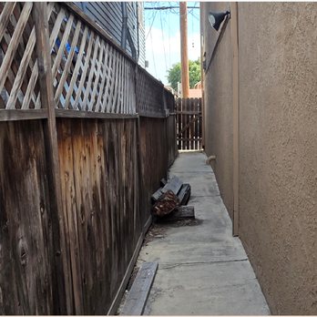 WCD Masonry - Before. Other end of the project area shows the old wood fence in need of replacement. - Masonry/Concrete Near Me - Long Beach, California