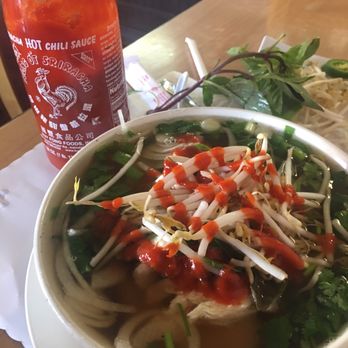 Pho Tho - Can't forget the rooster sauce on this already delicious soup - Vietnamese Near Me - Murrieta, California Pho Tho - Can't forget the rooster sauce on this already delicious soup - Vietnamese Near Me - Murrieta, California