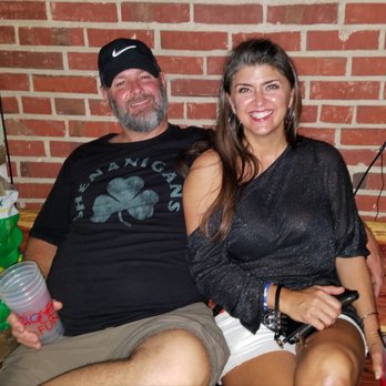 Cedar Street Social Club - a man and a woman sitting on a couch - Bars Near Me - Mobile, Alabama Cedar Street Social Club - a man and a woman sitting on a couch - Bars Near Me - Mobile, Alabama