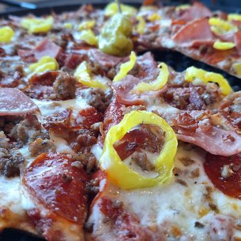 Pirate's Pizza & Wings - 16" meat with added banana peppers on a thin crust. - Chicken Wings Near Me - Dauphin Island, Alabama Pirate's Pizza & Wings - 16" meat with added banana peppers on a thin crust. - Chicken Wings Near Me - Dauphin Island, Alabama